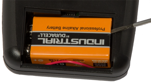 Using a tool to remove the battery