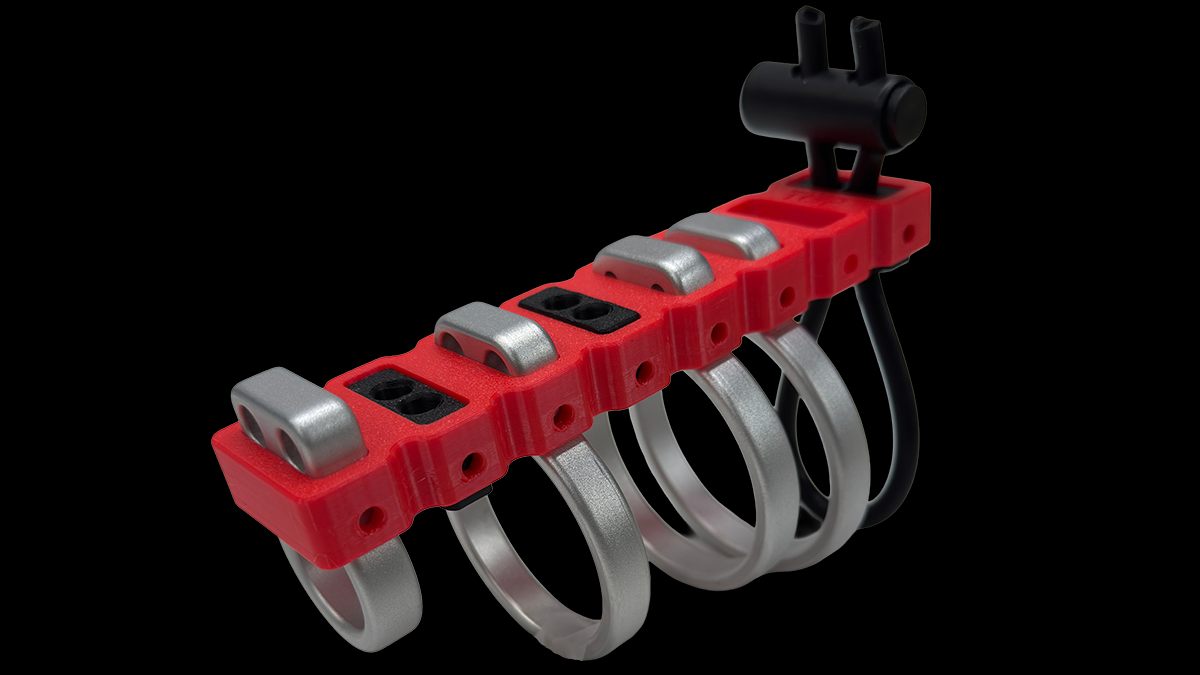 Fully loaded E-Stim Systems Ring Rack on a black background