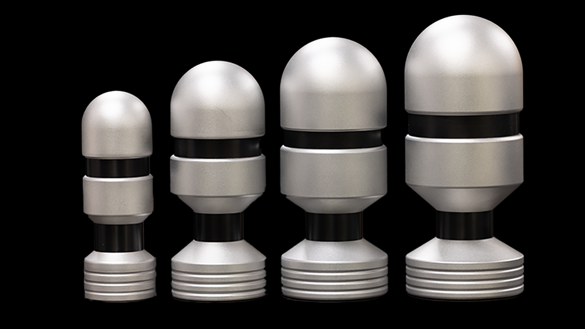 A Large E-Stim Systems Tripple Electrode on a Black Background